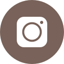 An icon of a brown circle with a white Instagram logo in the center. 